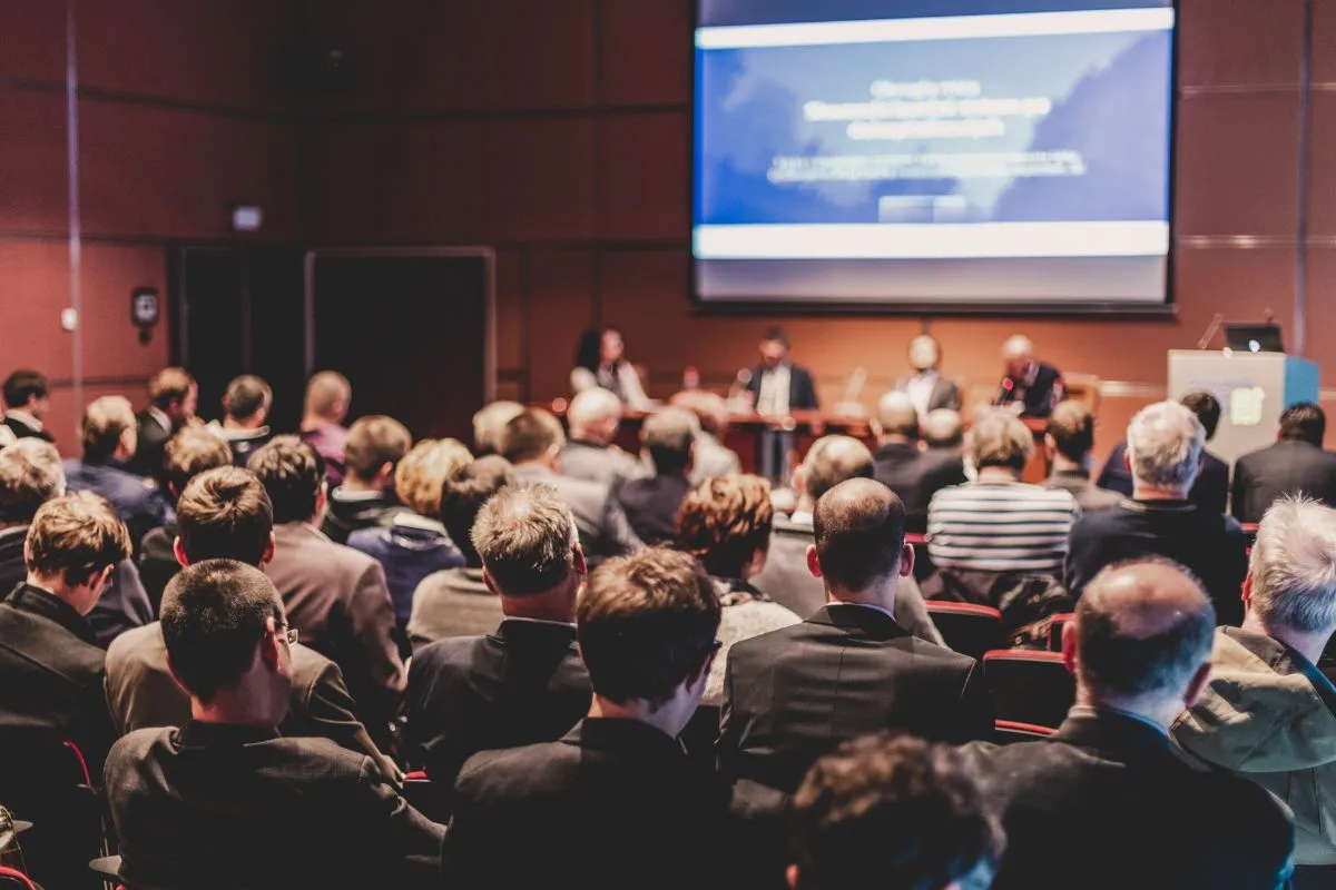 Audience attending a panel discussion at a corporate event featuring live entertainment ideas for corporate events in Washington DC